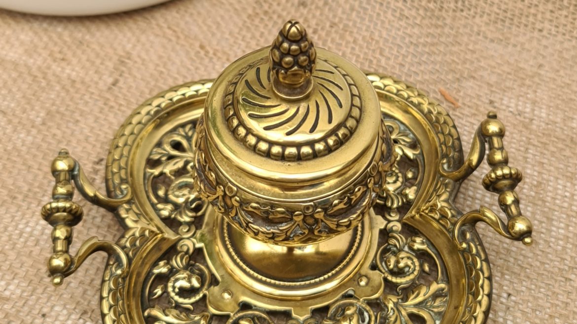 Antiques Brass Desk Top Inkwell With Pierced Vine Tray Base, Embossed Swags on The Inkwell and Ornate Finial on The Lid